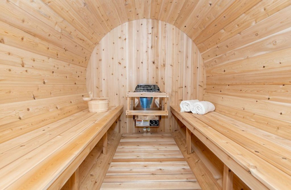 CT Tranquility Barrel Sauna interior with electric heater and two-tier benches