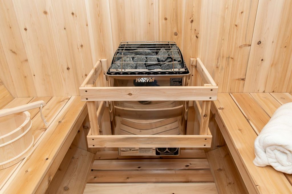CT Tranquility Barrel Sauna Harvia electric heater close-up with sauna stones