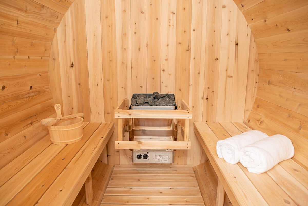 CT Harmony Barrel Sauna interior with electric heater and benches