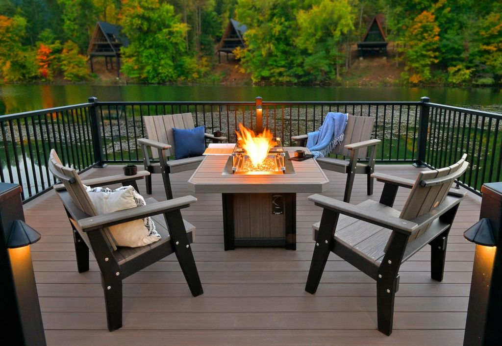 LFP51R Lumin Fire Pit 51 inch Rectangular on lakeside deck with Coastal Gray finish and Adirondack chairs