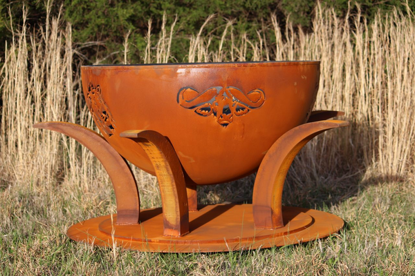 Africa's Big Five fire pit bowl outdoors with rust patina